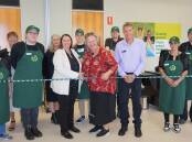 Front row, centre Sarah Corey, general manager of the mini Woolies program, enterprise operations with Woolworths Group Kate Lowe and Phil Clarson Team Leader IMRS at the opening of a mini woolies location. Griffith is set to open an outlet at TAFE in June. Picture supplied