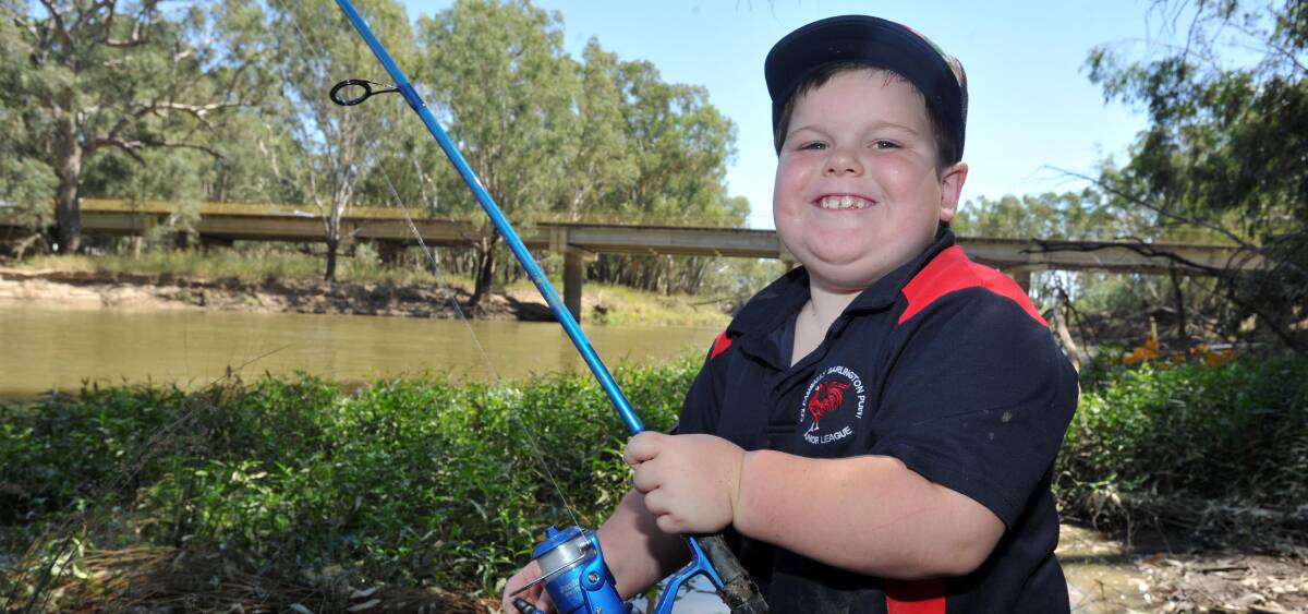 SMILES ALL ROUND: Brodie Legge, 7, drops a line in the Murrumbidgee River at the Riverina Classic held at Darlington Point on the weekend. Picture: Anthony Stipo