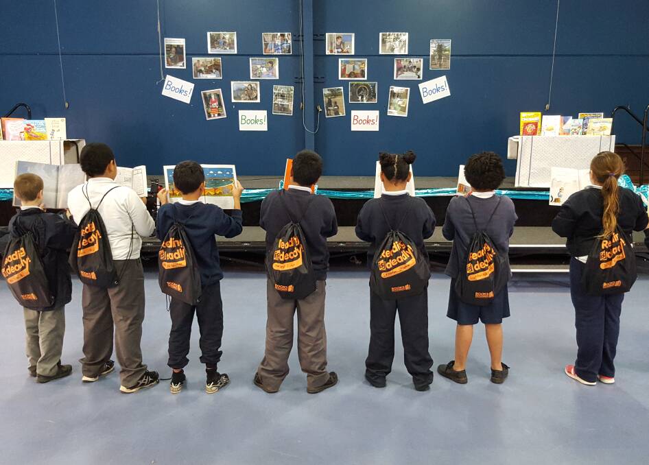 READY TO READ: Griffith Public School pupils proudly show off their book bags.