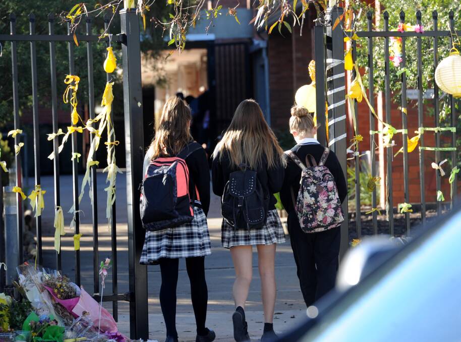 A TOUGH DAY: Students return to Leeton High School on Tuesday morning. Picture: Anthony Stipo