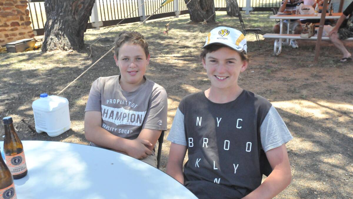 Will Geddes, 13, and Michael Conlan, 14, catch up at the Binya arts and craft event.