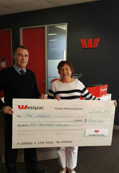 WORTHY RECIPIENT: Westpac Griffith bank manager George Der Matossian hands over a $500 cheque to Olga Forner from Can Assist. Picture: Supplied