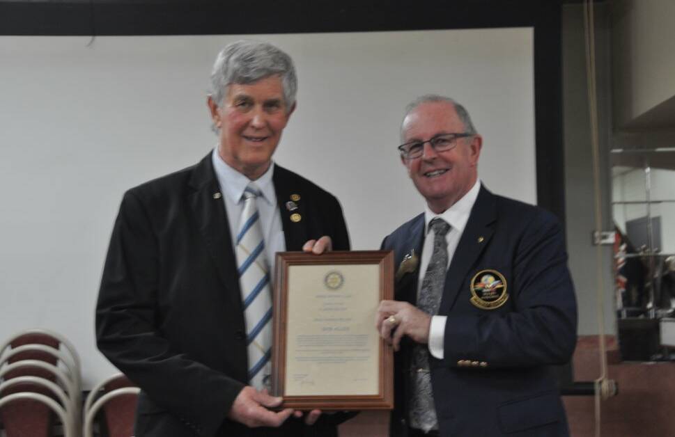 TOP HONOUR: Yenda Rotary Club member Bob Allen is presented with the award by Rotary District 9700 Governor Gary Roberts.