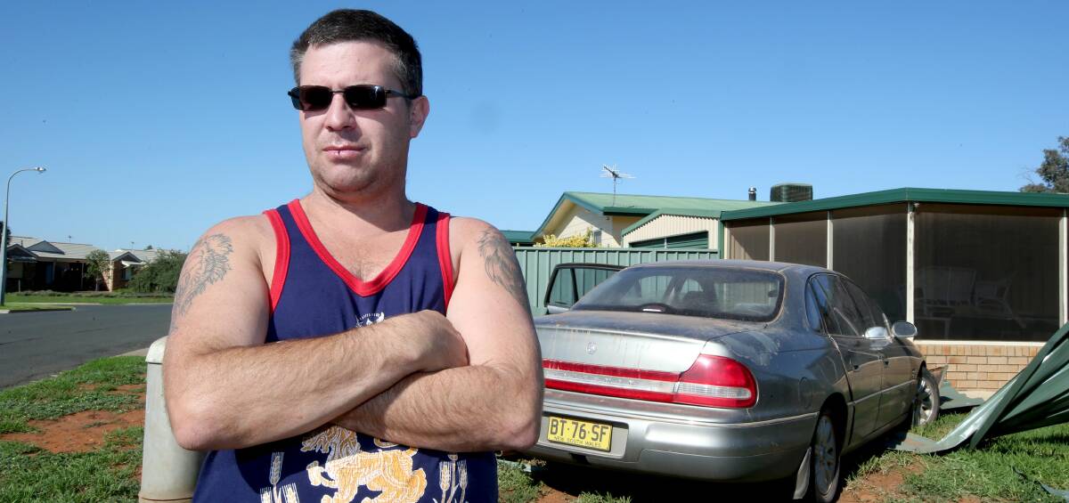 SHOCK: Stuart Shaw got a shock when a car came crashing through his back fence and into his house before 5am on Tuesday morning. Picture: Anthony Stipo