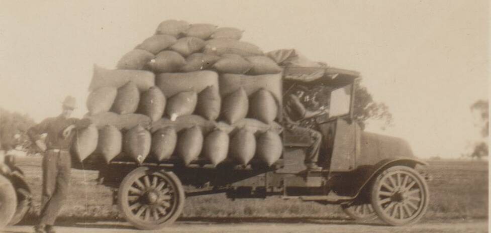IN THE GOOD OLD DAYS: Bags of rice were manually loaded onto trucks.