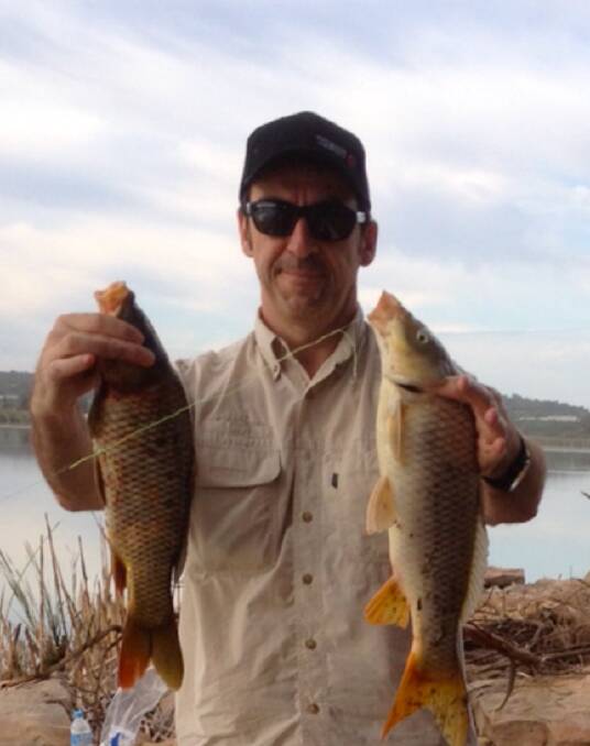 RESEARCH: Professor Gilles Guillemin with carp collected from Lake Wyangan for research.