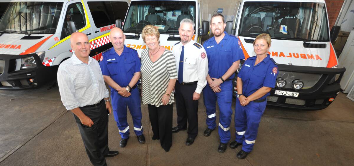 CASH INJECTION: Adrian Piccoli, John Murphy, NSW Health Minister Jillian Skinner, Andrew Long and paramedics Nathan O'Brien and Alissa Fuller. Picture: Anthony Stipo