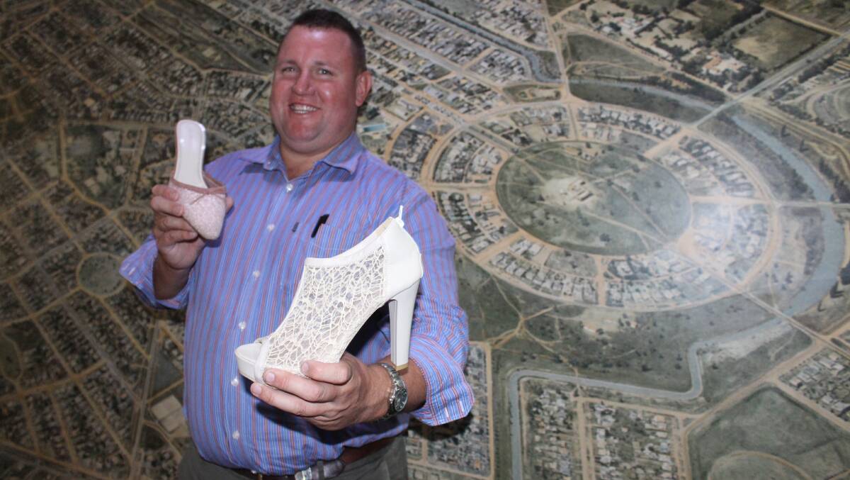 HEELS: Deputy mayor Doug Curran shows off some fancy footware ahead of this year's Walk A Mile in Her Shoes event. Picture: Stephen Mudd.