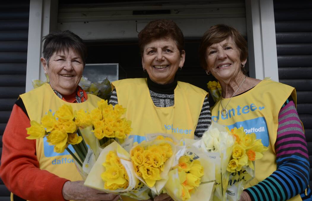 DAFFODIL DAY: Cancer Council volunteers Carole Young, Deanna Marriott and Carmel Jamieson were run off their feet by the generosity Griffith residents showed on Daffodil Day.