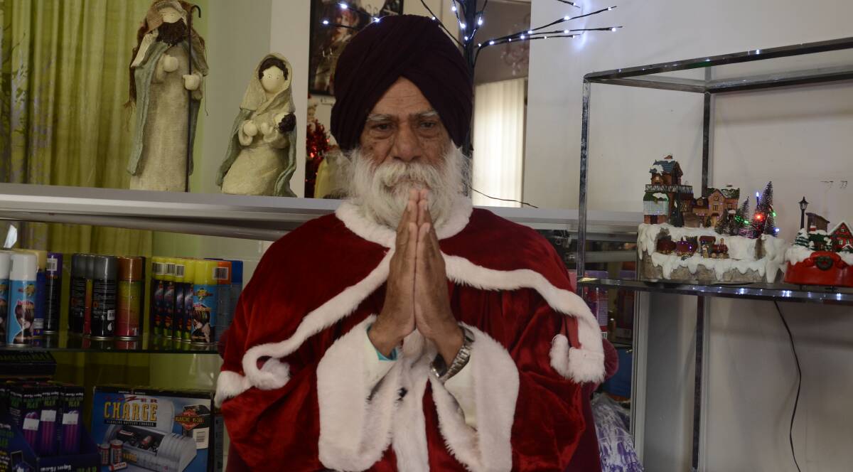 CHRISTMAS: Amarjit Singh looks forward to the Christmas season and takes pride in suiting up for the occasion with a costume provided by Betty Boo.