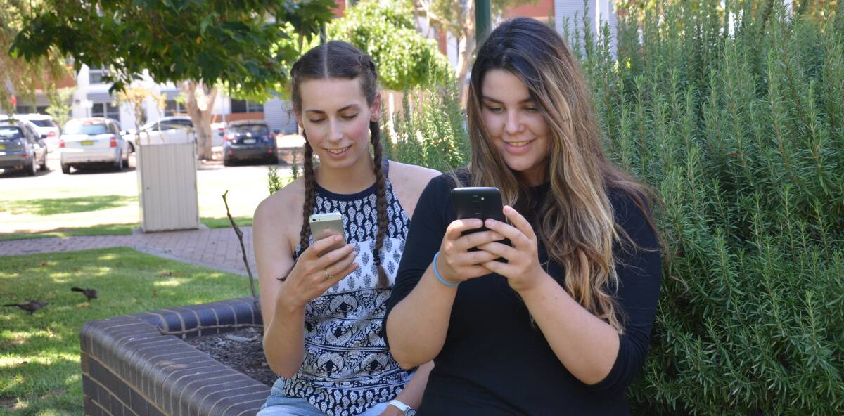RESULTS: Uni hopefuls Thea Bianchini and Natasha Curley look forward to the main round of offers released through the My UAC mobile app. 