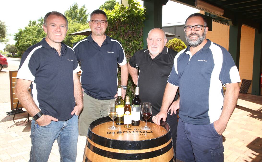 WINE SUCCESS: John Coughlan, Victor DeBortoli, Rob Glastonbury and Robert Delgando toast to De Bortoli Wines sucess throughout the year after taking in a massive medal haul.