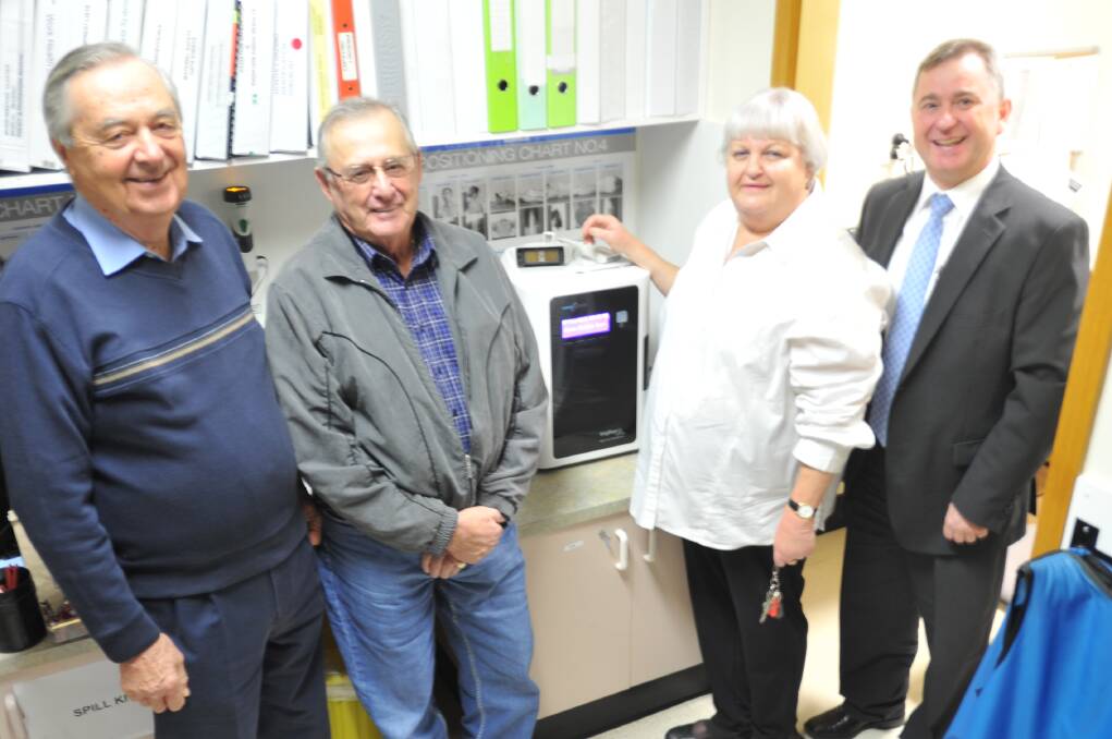 FOCUS ON SAFETY: Mick Plos, Griffith mayor John Dal Broi, Meredith Whittaker and Morris Massarotto with the new disinfection unit. Picture: Hannah Higgins.
