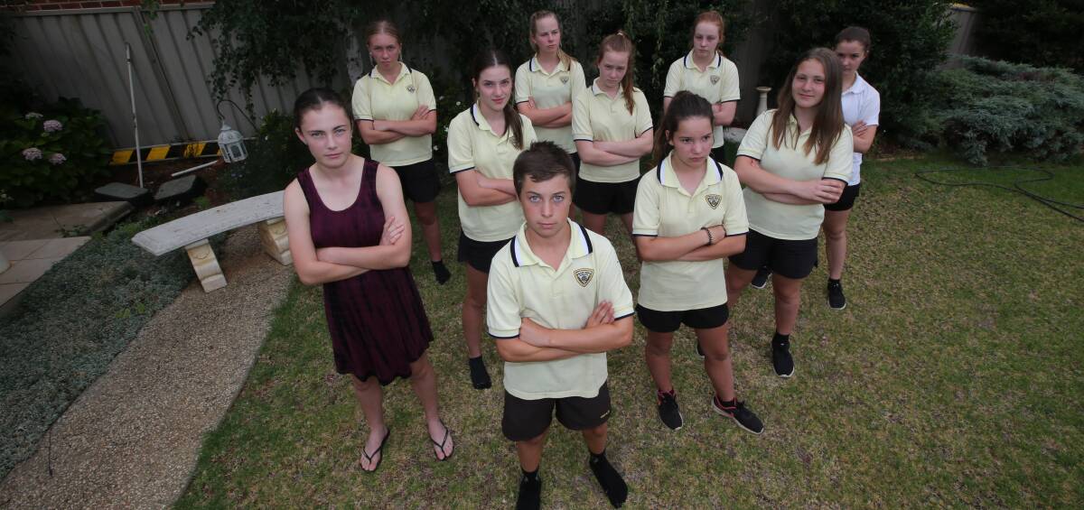 ANOTHER BRICK IN THE WALL: The students say they can see some benefits to a merger but are concerned about their schooling during the change. PHOTO: Anthony Stipo.