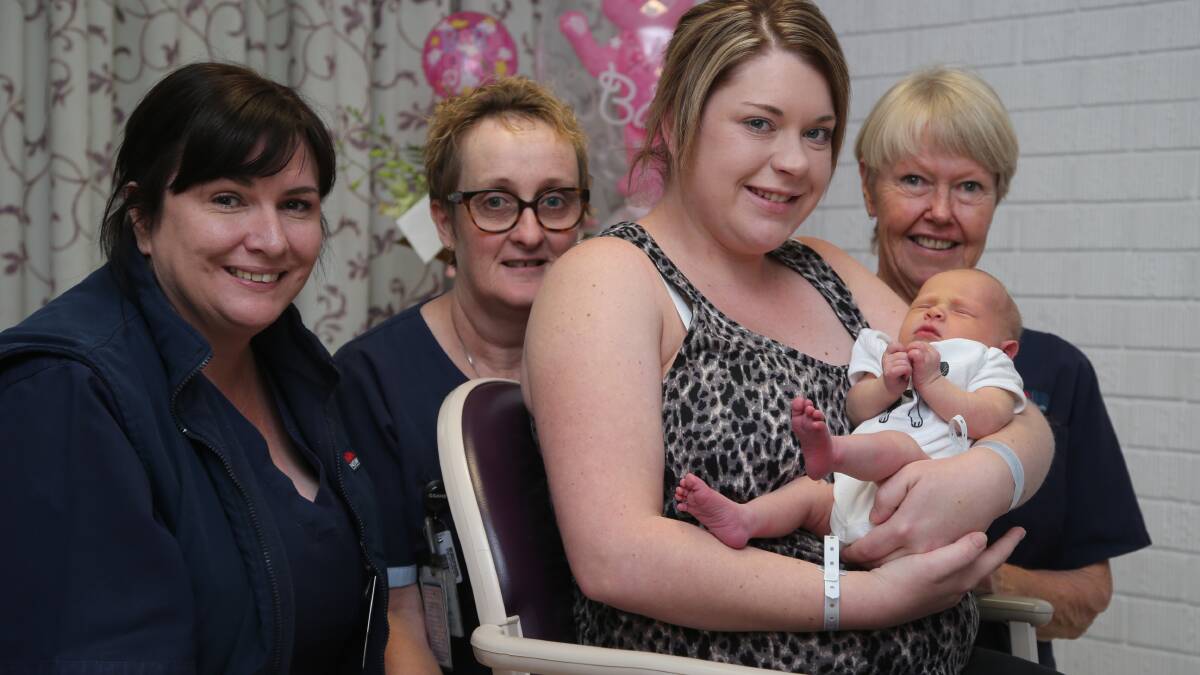 DAY OF THE MIDWIFE: Midwives Suzanne McKelvie, Bernadette Hannon and Lynn Beer with new mother Michelle Crowe and three-day-old Indie.