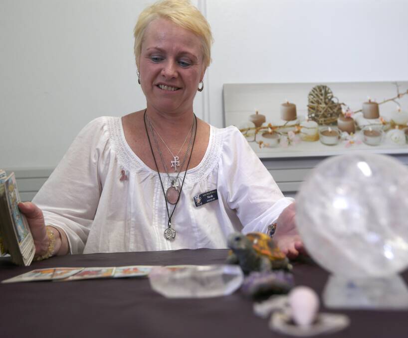 READING: Nicole Rowley, organiser of the Griffith Mind, Body and Spirit Festival is reading her tarot cards and predicting a successful event this weekend. Picture: Anthony Stipo.