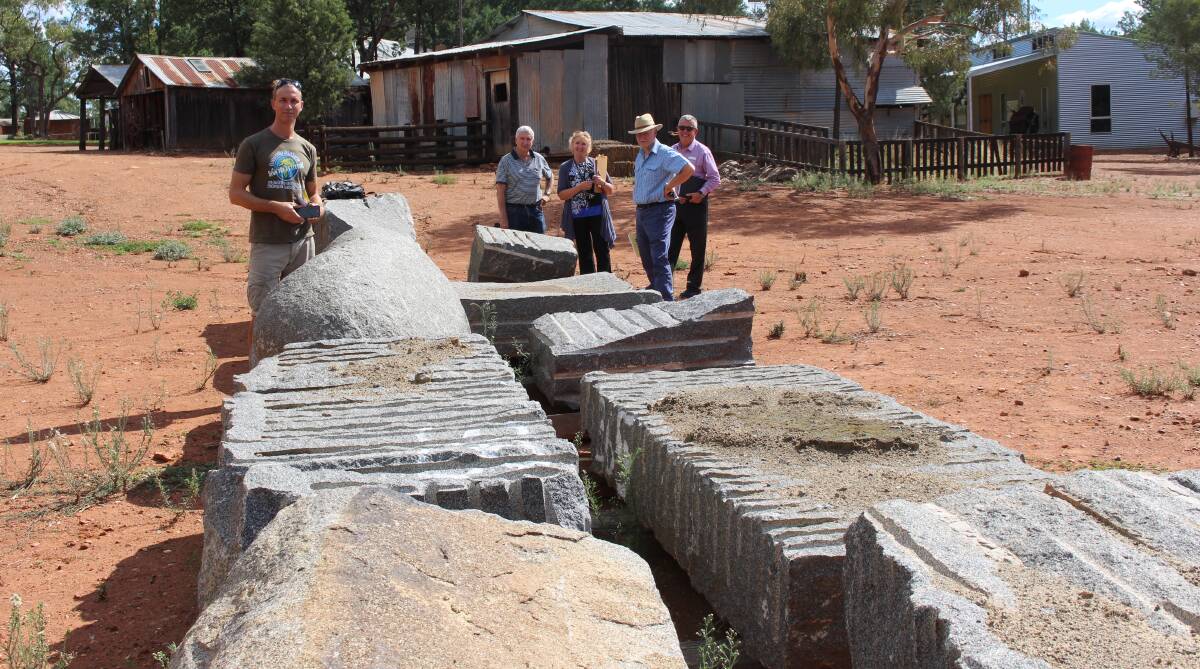 READY: Luke Zwolsman stands with Allan Smith, Jenny O'Donnell, Noel Hicks and Greg Lawrence behind the slabs of granite that will become sculptures.