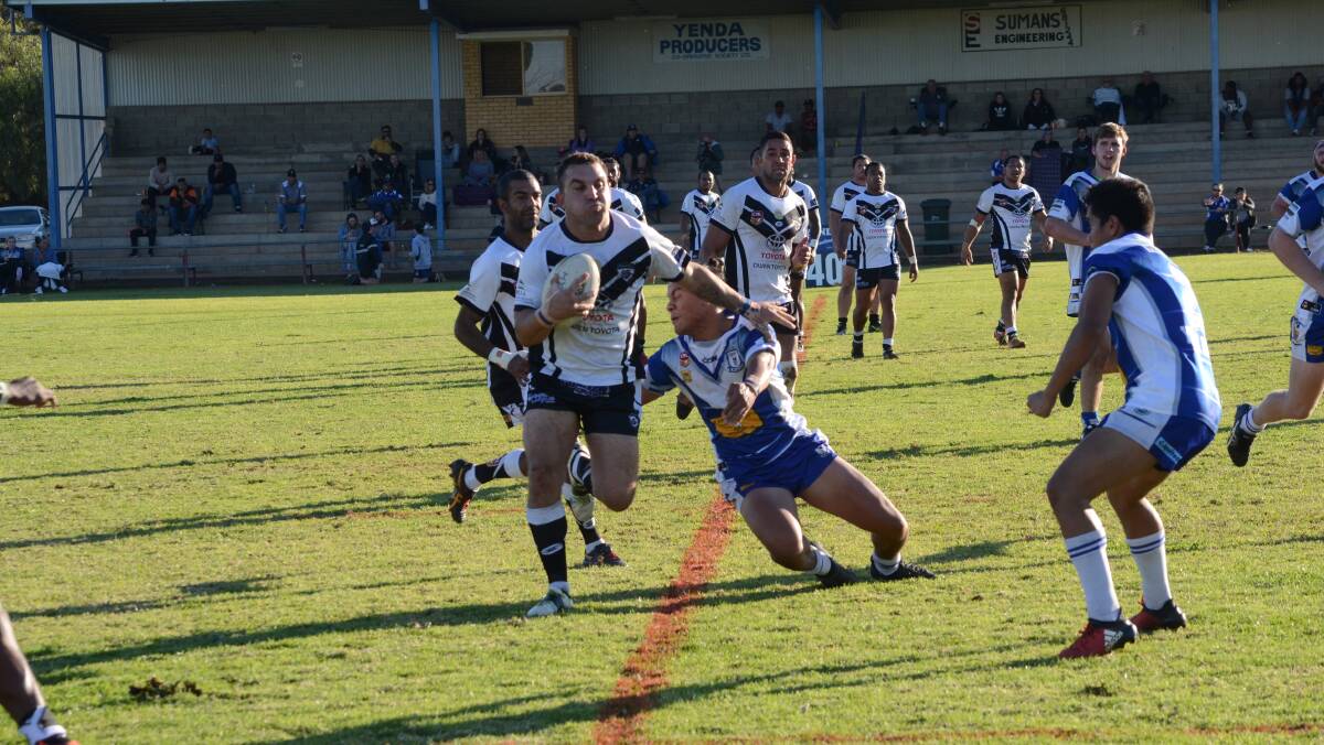 PUSHING THROUGH: Josh Charles evades the defence for the Black and Whites.