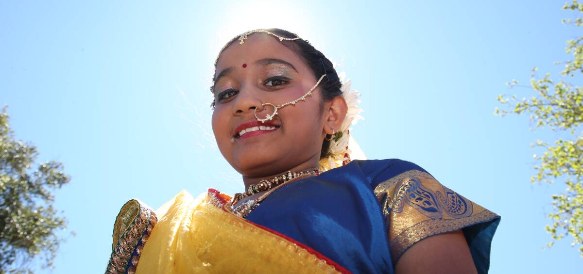 FESTIVAL: Stuti Chatterji, 8, was a ray of sunshine wearing her traditional Indian clothing at the annual Griffith Multicultural Festival. Picture: Anthony Stipo.