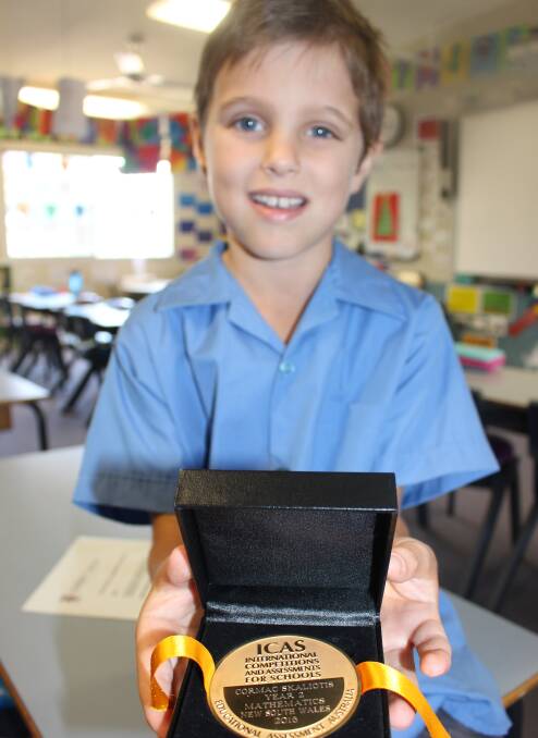 PERFECT SCORE: Eight-year-old Cormac Skaliotis with his medal.