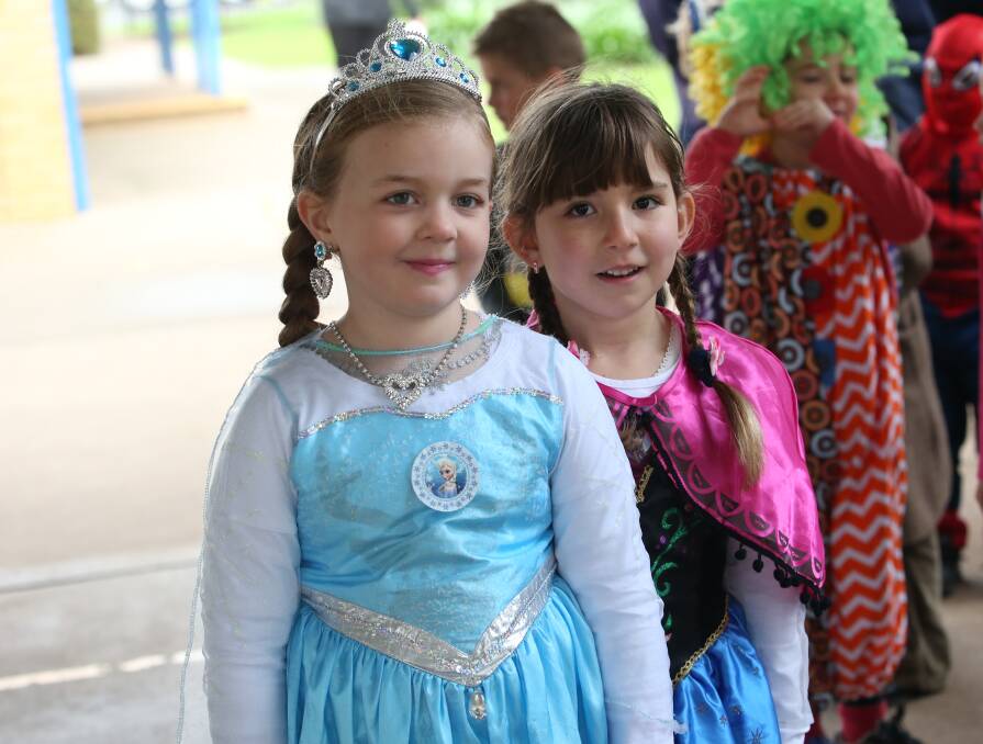 Imogen Grant and Monica Ristevski as Elsa and Anna from Frozen.