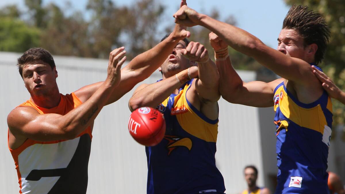 SPOILED: West Coast's Frasier McInnes and Tom Cole look to spoil GWS forward Jon Patton at Narrandera Sportsground on Saturday. Picture: Les Smith