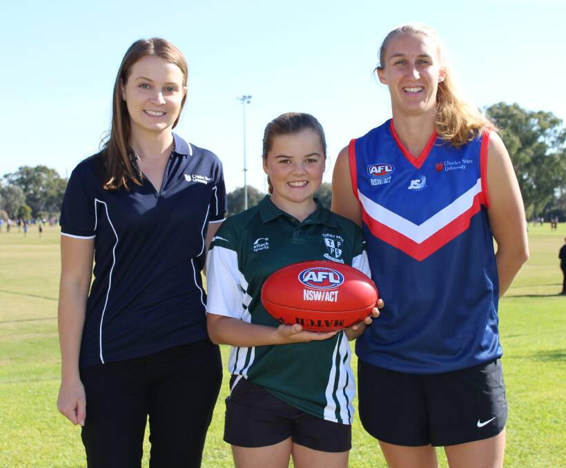 EXCITING TIMES: Southern NSW AFL women's captain Clare Lawton with Turvey Park Public student Aliya Creek and CSU's Morgan Harrigan. Picture: Sarah Braybon