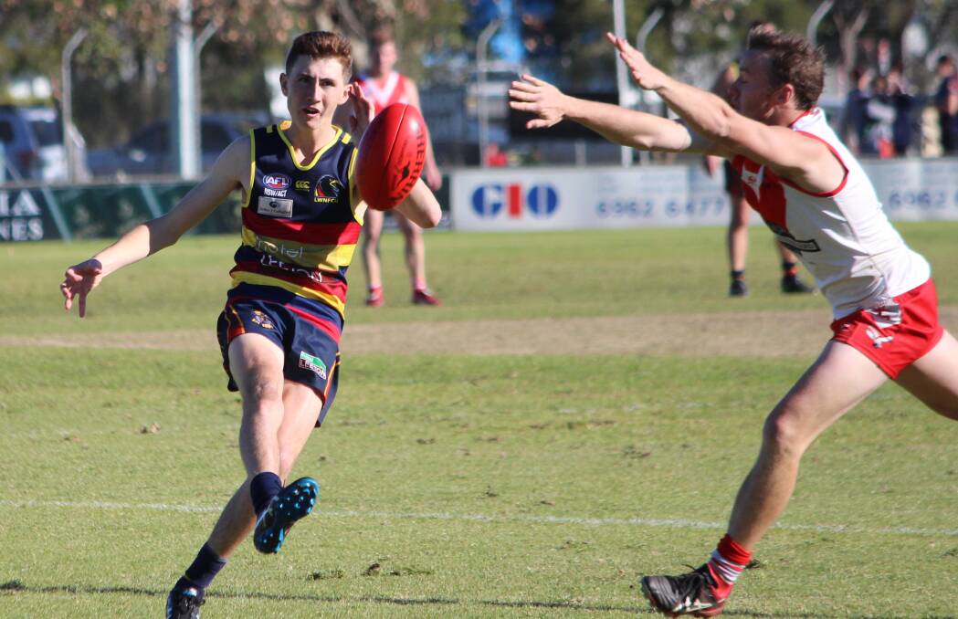 PINPOINT: Leeton-Whitton's Tyh Evans gets a kick away in the win over Griffith at Exies Oval on Saturday. Picture: Ben Jaffrey