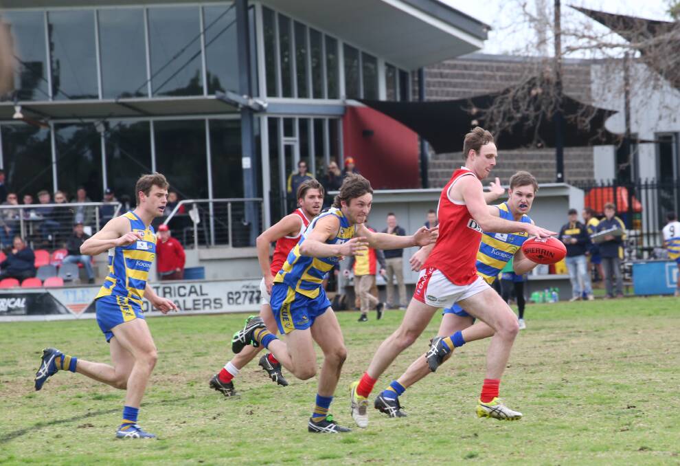 HEADING BACK: Collingullie-Glenfield Park's Matt Beckmans kicks on goal during last year's first semi-final at Exies Oval in Griffith. Picture: Anthony Stipo