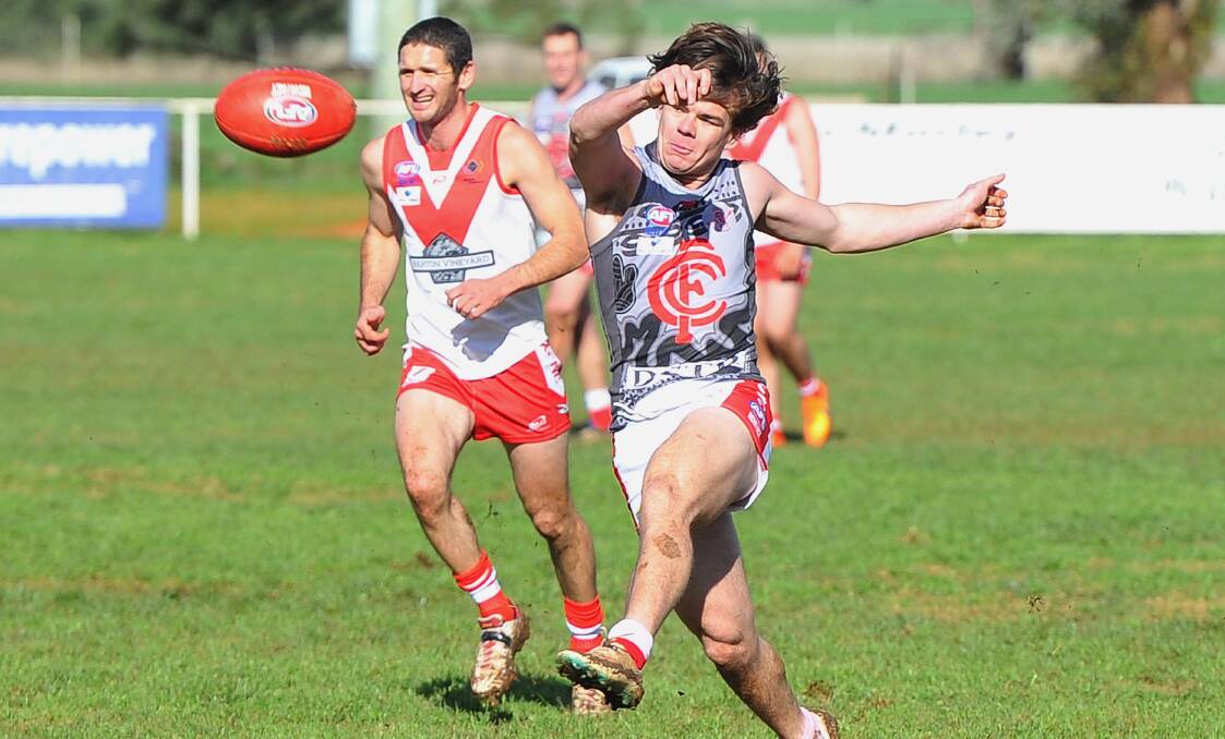 ON FIRE: Collingullie-Glenfield Park's Nick Kennedy bangs the ball into the forward line against Griffith on Saturday. Picture: Kieren L Tilly