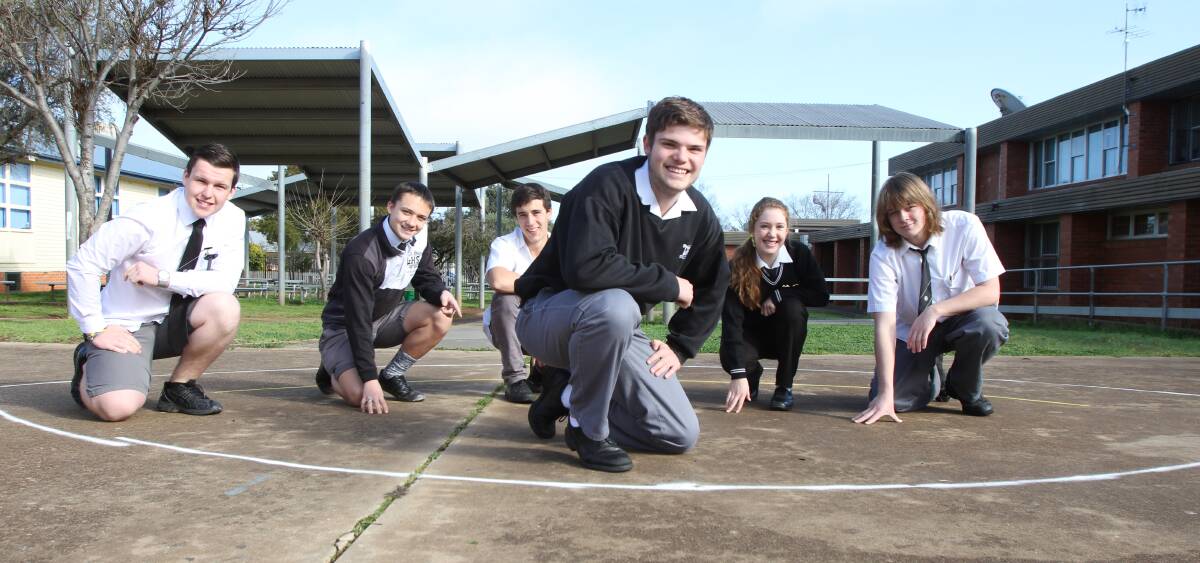 HONOUR: Students Adam Mitchell, Lane Smith, Marcello Carvalho, Mackenzie Saddler (project designer), Hannah Boardman and Jack Robbie where the tribute will be built. 
