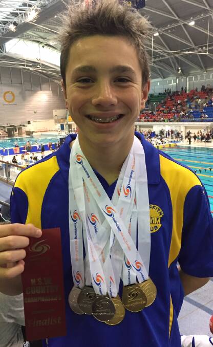 SHINING SMILE: Wil Donaldson showing off his excellent results at the championships.