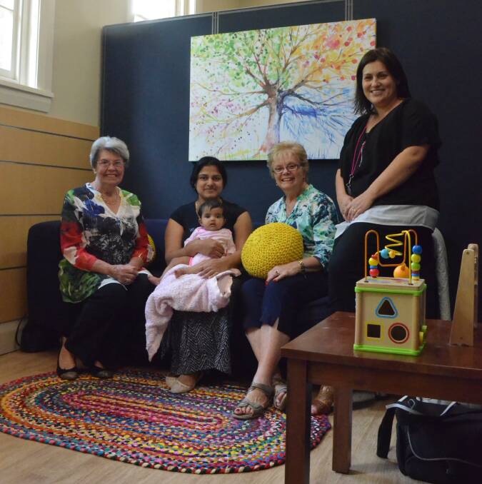 FAMILY CARE: Wilma Cunningham, Jismi Jacob and baby Hannah Ditto, Soroptimist President Gerry Rohan and Collections Team Leader Rina Cannon in the new parent's room at Griffith City Library. PHOTO: Jacinta Dickins.