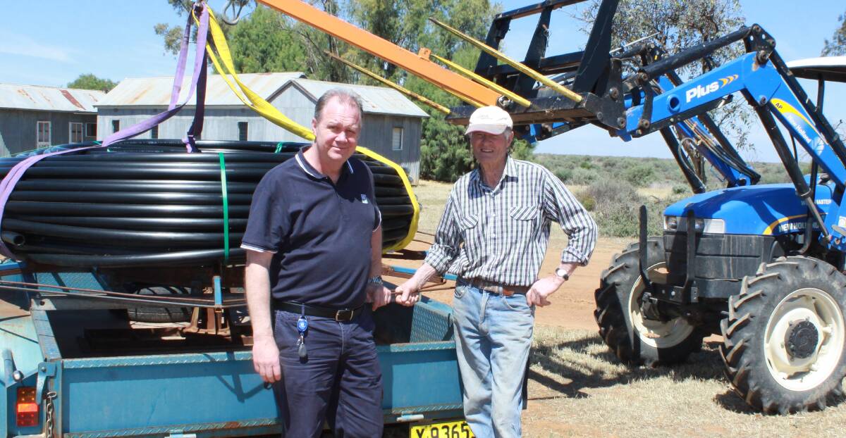 SETTING THE BAR:  MI engagement officer Scott Hanson with Wah Wah farmer Bruce McLean, one of the first farmers in the Wah Wah district to have completed his on-farm works. PHOTO: Supplied.