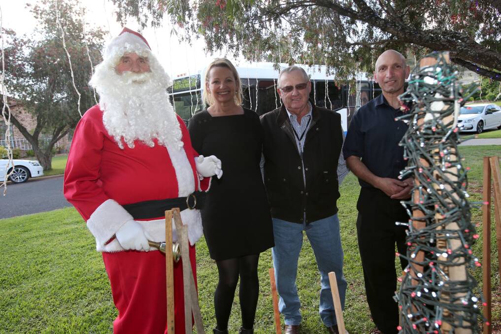 WHAT A SIGHT: Special guests Santa, Member for Farrer Sussan Ley and Mayor John Dal Broi all visited Roy Marando's spectacular lighting display to announce the funds for this year's Festival of Lights. PHOTO: Anthony Stipo.