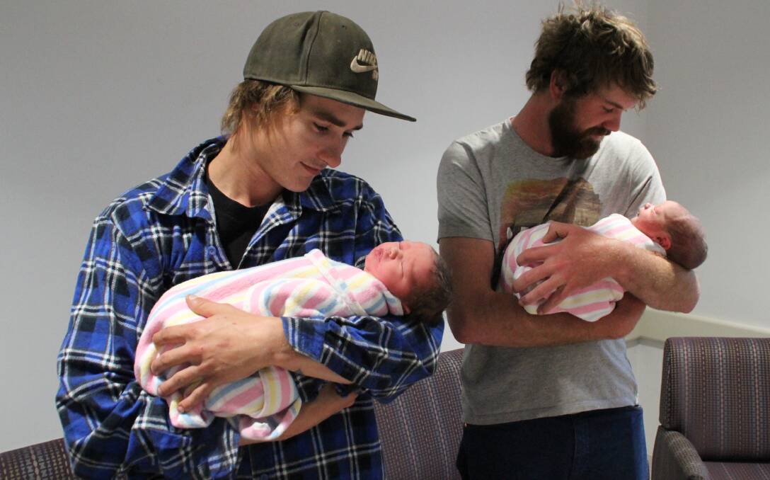 BABY DADDIES: It's clear that both fathers are estatic as they dote on their newest family members: Dylan Harm with his baby girl and Justin Webb with his little boy. PHOTO: Jacinta Dickins.