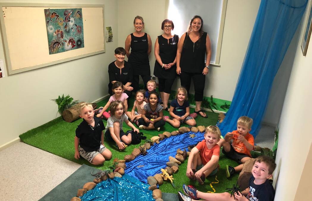 Educators Julie Vitucci and Charmaine Hannon with Director Suzy Tucker and educator Belinda Grandi from Griffith East Kindergarten with some of their students happily making a forest. PHOTO: Jacinta Dickins.