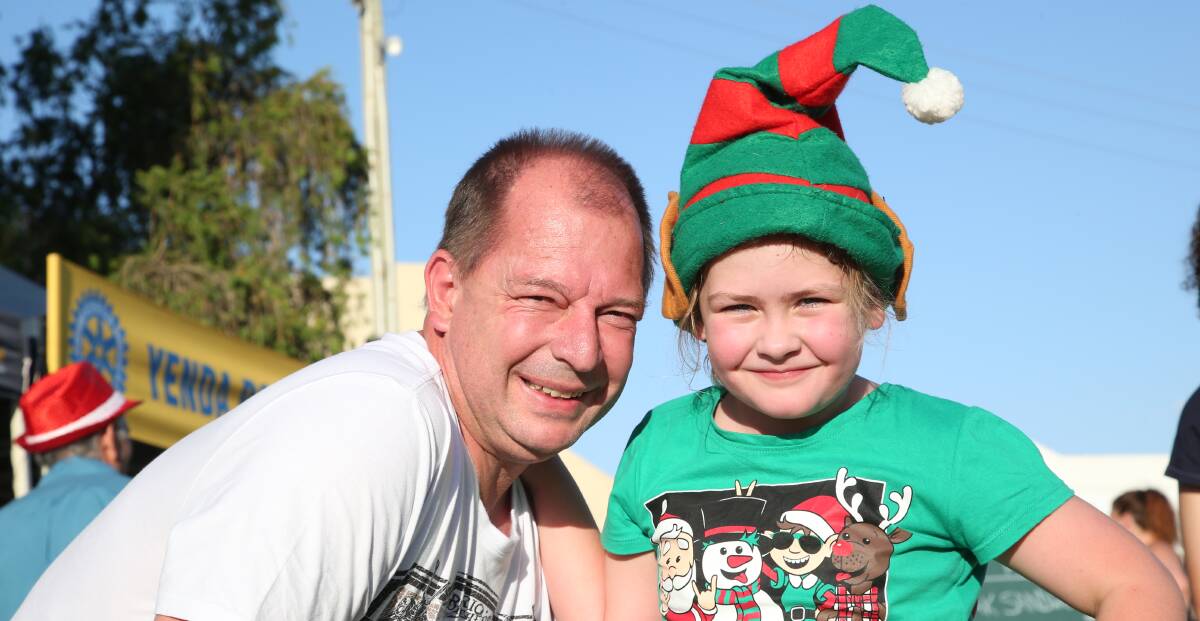 STUART Harris and daughter Mia get into the Christmas spirit at last year's Yenda carols.
