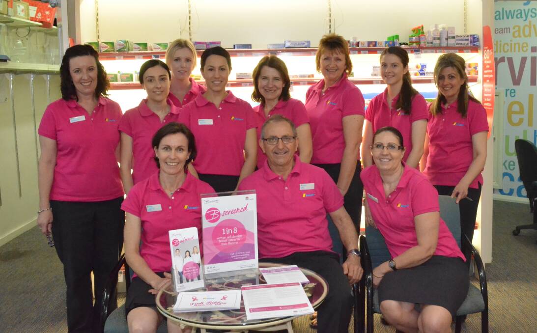 PINKED UP: The team from Amcal Griffith in the pink shirts they will be wearing throughout October to promote breast cancer awareness.