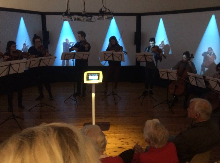 Life size projections of musicians from Australian Chamber Orchestra. 
