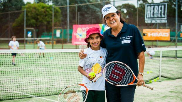 Evonne Goolagong Cawley at an indigenous tennis clinic with nin-year-old student Erica Church. Photo: Elesa Kurtz
