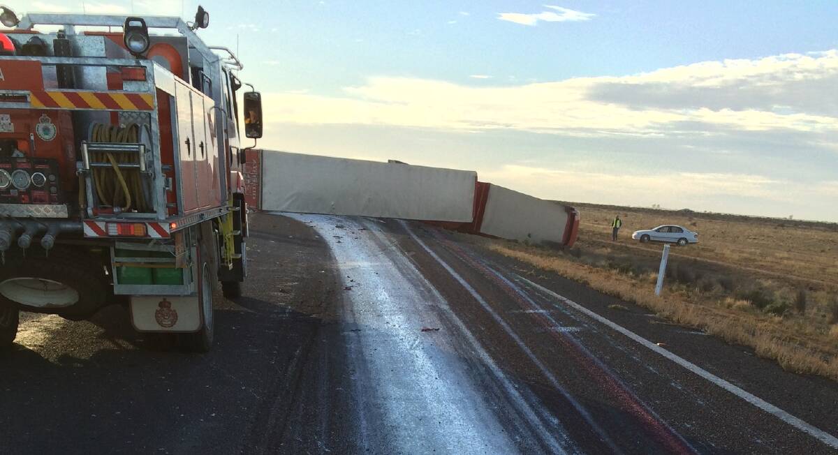 A truck driver escaped serious injury when his truck rolled on the Sturt Highway near Hay on Monday morning. Picture: Supplied