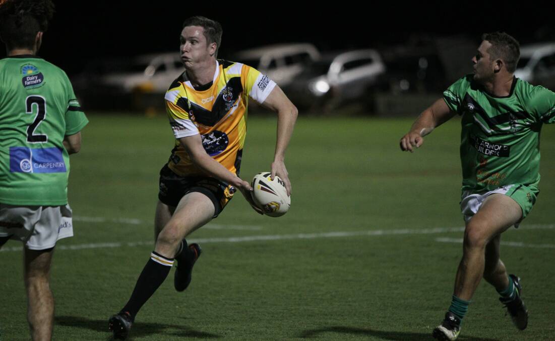 Gundagai fullback Dane O'Hehir looks to spread the ball during last year's West Wyalong Knockout by the Tigers won't play in the pre-season event this year.