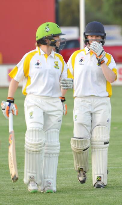 RETURN: Alex and Kate Blackwell stride out to the crease together on Thursday evening. Picture: Ben Jaffrey