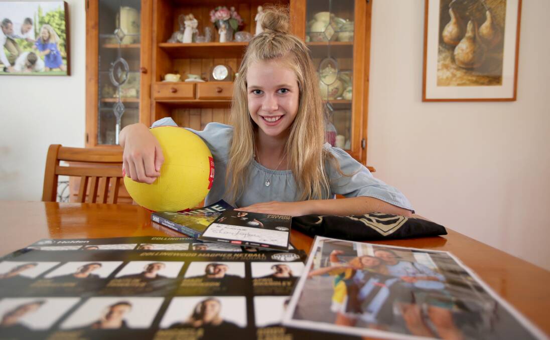 MEMORABLE: Ava Kelly with some memorabilia signed by Sharni Layton. PHOTO: Anthony Stipo