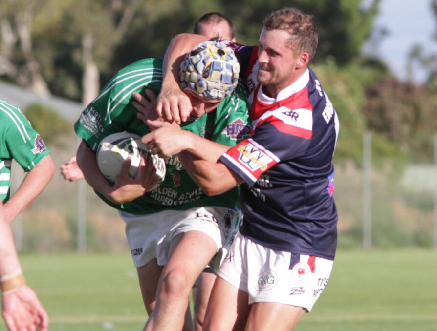 TACKLE: DPC's Clinton Green goes high on Leeton's Todd Prest earlier this year. Picture: Ron Arel
