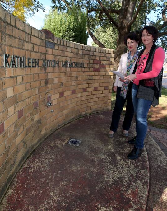 NEGLECT: Marie Towns and Melissa Dal Broi look at the Kathleen Aiton Memorial at Egg Park. Picture: Anthony Stipo.