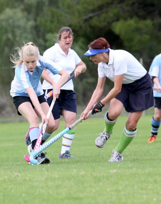 TUSSLE: Pinnacle's Alex West and Griffith Retirement Estate's Anna Stoll fight for the ball. Picture: Anthony Stipo