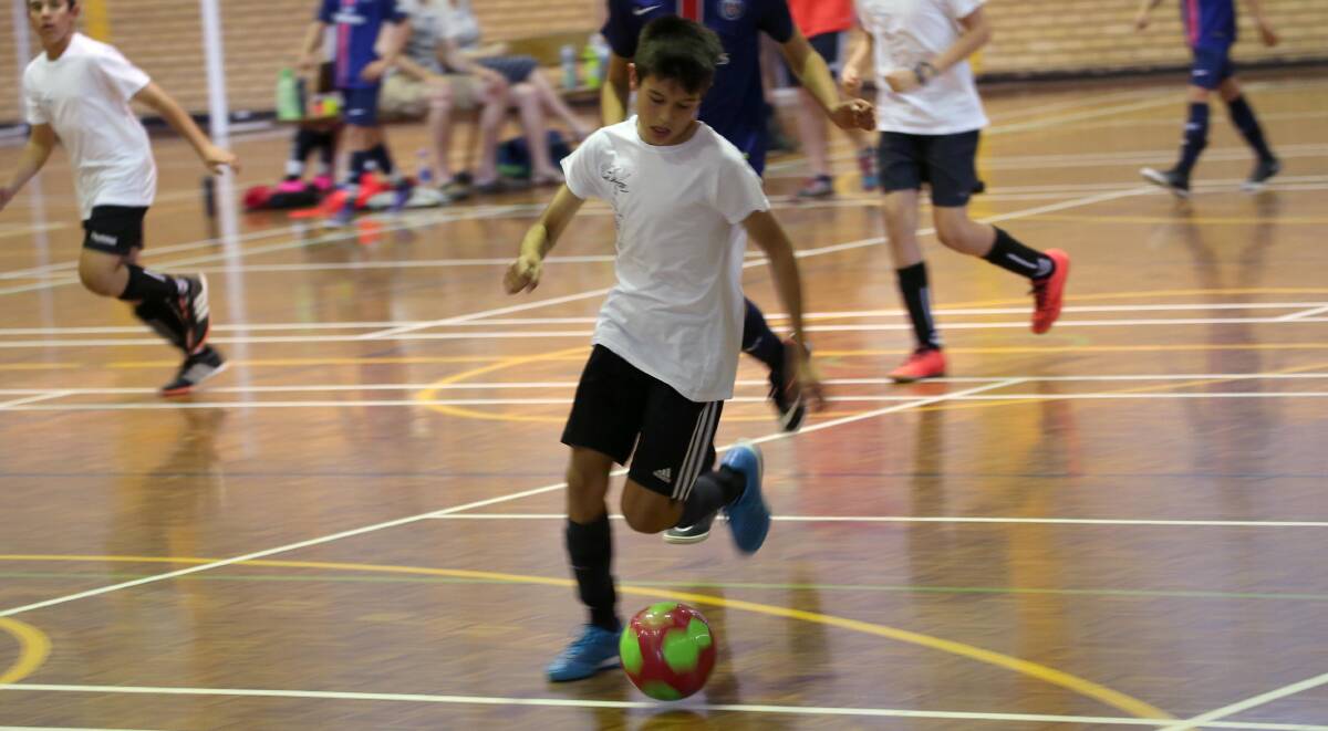SKILLS: Globe Backpackers Victor Catanzariti dribbles the ball up the court during the futsal season. Picture: Anthony Stipo