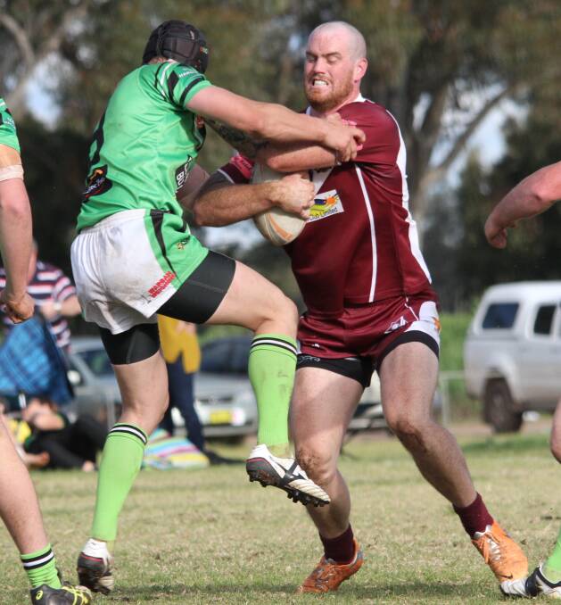 CONTACT: Yanco-Wamoon's Hayden Brooks is hit by a Leeton defender. Picture: Ron Arel
